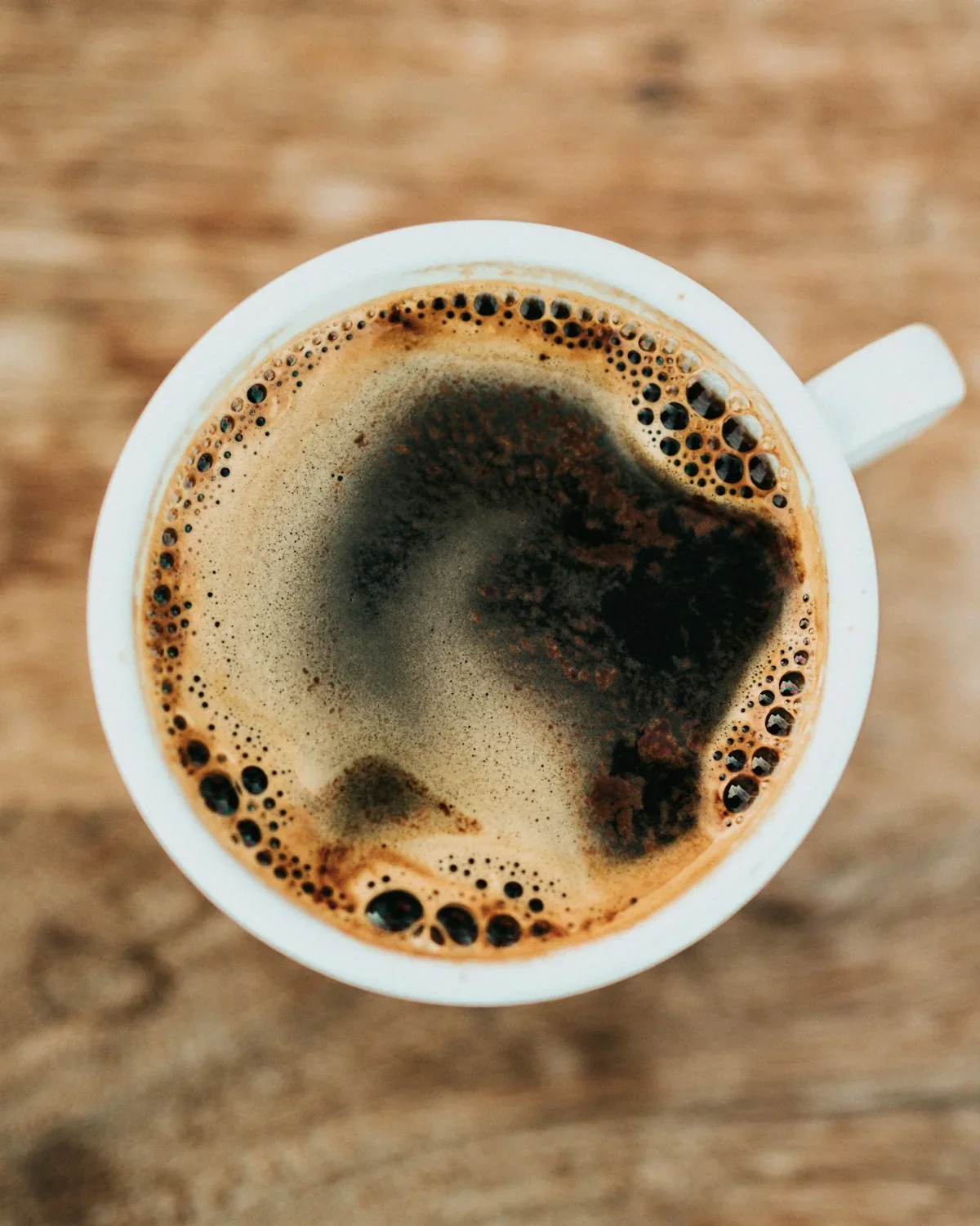 Dark Malaysian kopi in a glass cup